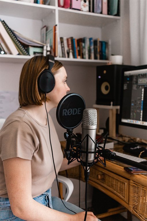woman speaking into a microphone